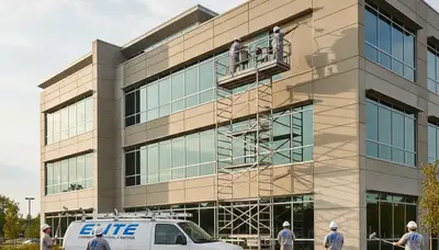 Professional commercial painters coating Clearwater FL business exterior with durable finish